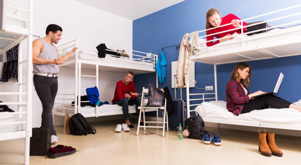 istock Travelers communicating in hostel bedroom 1172562263