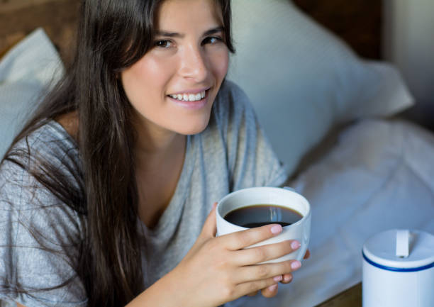 istock Young woman having breakfast in bed 1172562457