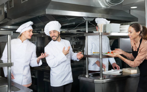 istock Chef checking dishes in kitchen of restaurant 1172562575