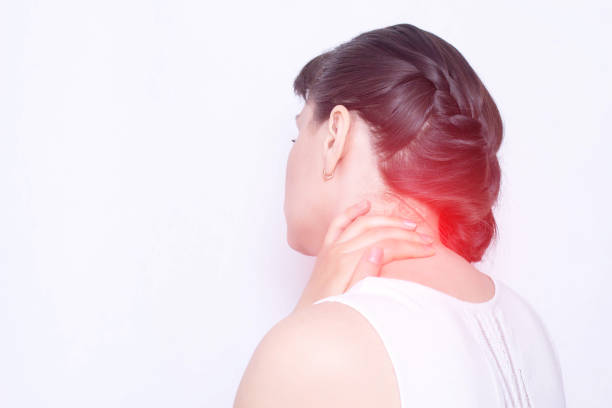 A young girl holds on to a sore neck in which the protrusion and fibromyalgia of the muscles, medical, copy space, vertebral instability A young girl holds on to a sore neck in which the protrusion and fibromyalgia of the muscles, medical, copy space, shoulder girdle periarthritis cartilage photos stock pictures, royalty-free photos & images