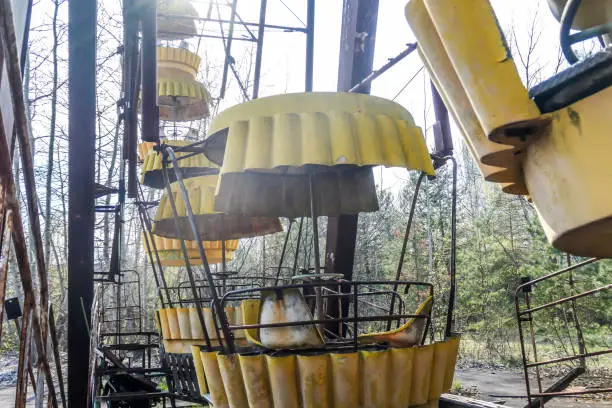 Abandoned Pripyat amusement park. Due to the Chernobyl nuclear explosion it was never open. A close up on one of the sets of big marry-goes-round, ferry wheel. Abandoned lunapark.