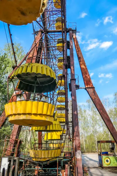 Abandoned Pripyat amusement park. Due to the Chernobyl nuclear explosion it was never open. A close up on one of the sets of big marry-goes-round, ferry wheel. Abandoned lunapark.