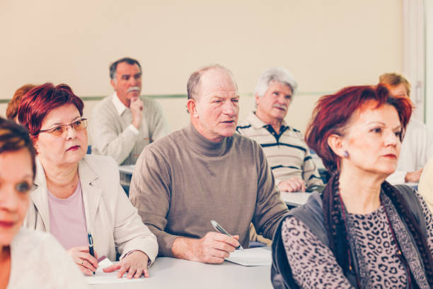 istock Group of seniors on motivation seminar 1172564015