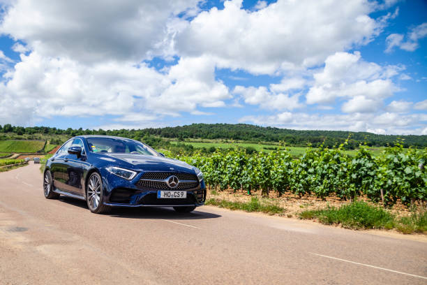 france lyon 2019-06-20 closeup front view luxury dark blue german car sedan premium mercedes cla with eu registration number on road at french vineyards. concept wine travel in beaune burgundy - german countryside imagens e fotografias de stock