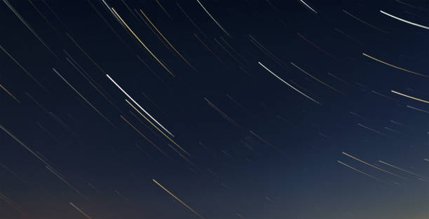 Startrails in the sky under the starry sky stock photo