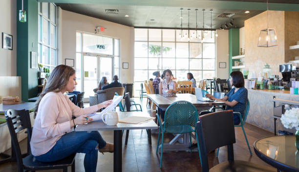 istock Multi-ethnic group of daily customers at coffee shop 1172566620