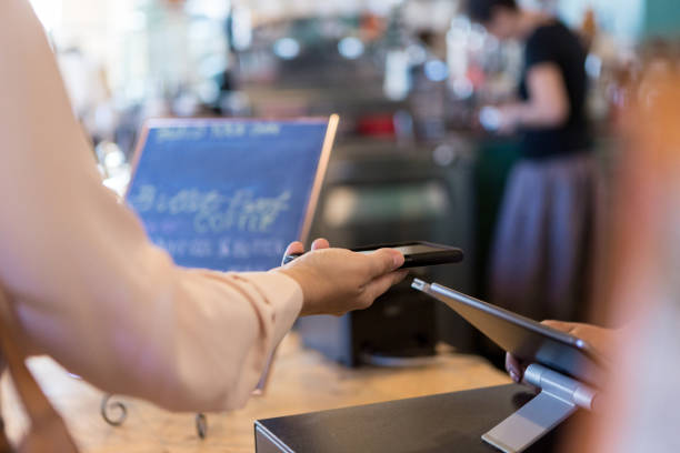 istock Unrecognizable customer scans smart phone to pay for coffee 1172566627