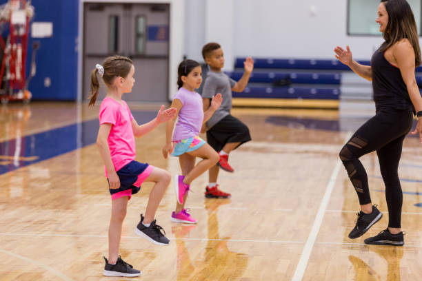 istock Energetic children participate in exercise class 1172566696