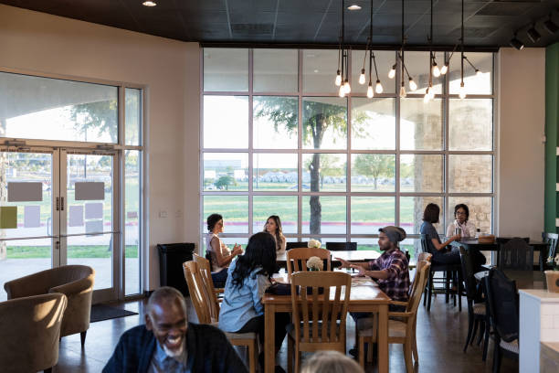 istock People having coffee in trendy cafe 1172567926