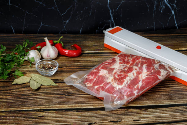 istock Bagging of meat with a device . 1172569988