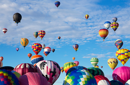 Albuquerque, New Mexico - October 1, 2016: Photo was taken during early morning. This is one of the biggest events of the fiesta, where all participating balloons launch in two waves, filling the sky with hundreds of balloons at once.