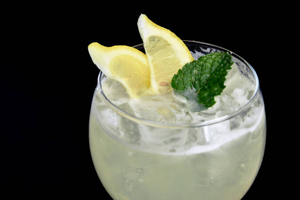 istock ALCOHOLIC DRINK WITH FRUIT COCKTEL on black background, 1172571438
