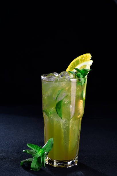 istock ALCOHOLIC DRINK WITH FRUIT COCKTEL on black background, 1172571486