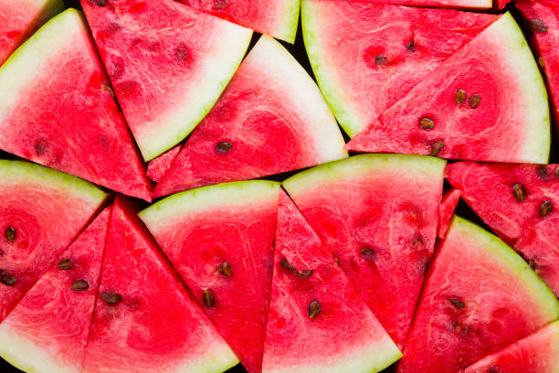 istock Watermelon pattern. Sliced watermelon top view. Ripe watermelon with seeds. Summer creative concept 1172572479