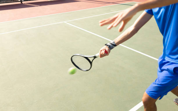 istock Adult man playing tennis 1172572878