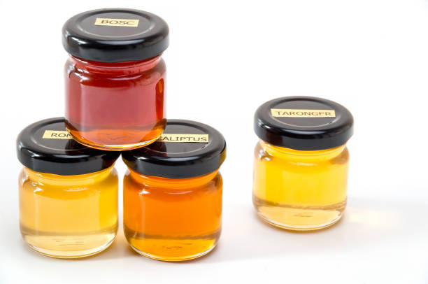 istock Jars with honey with labels on white background 1172573709