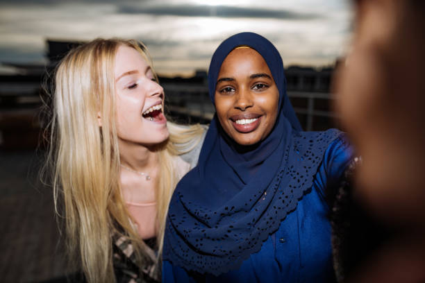 Diverse friends taking selfie and smiling Generation Z and Millennials in Nordic countries scandinavian ethnicity stock pictures, royalty-free photos & images