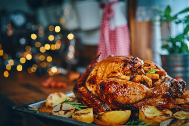 istock Preparing Stuffed Turkey for Holidays in Domestic Kitchen 1172577132