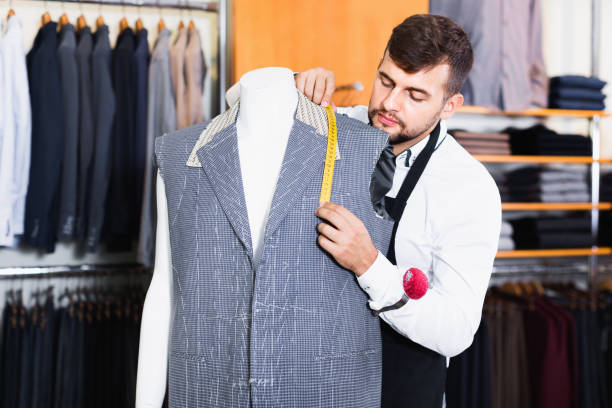 istock Handsome male tailor  working  in atelier 1172577275