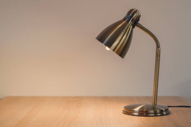 istock Lamp on the desk top, space for text 1172578963