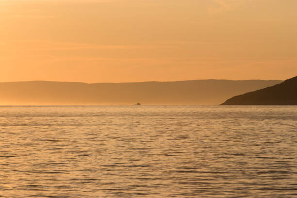 istock Boat on sea at sunset 1172580336
