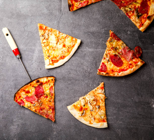 istock Pizza Assortment Pepperoni Salami Bacon Tomatoes  Mozzarella  Four Cheese on  stone Background Bake Spicy Snack Top View Copy space for Text 1172581485