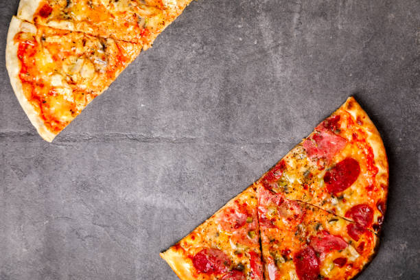istock Pizza Assortment Pepperoni Salami Bacon Tomatoes  Mozzarella  Four Cheese on  stone Background Bake Spicy Snack Top View Copy space for Text 1172581524