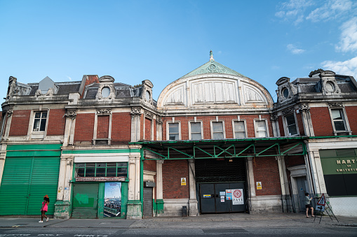 Smithfield meat market is one of the oldest operating markets since medieval ages. Old market building is seen in photo which was taken in summer during day time.