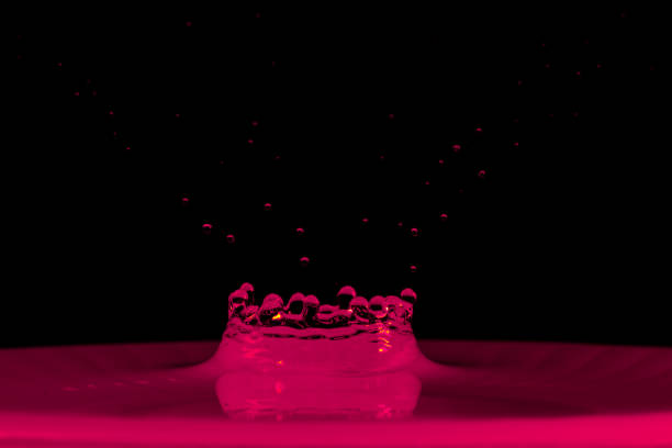 drop of water falling down in the water macro photo