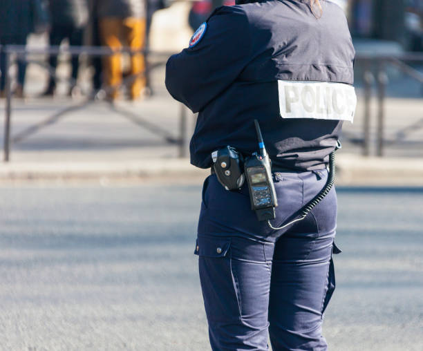 istock Fully equipped woman policeman monitors traffic management. 1172584645