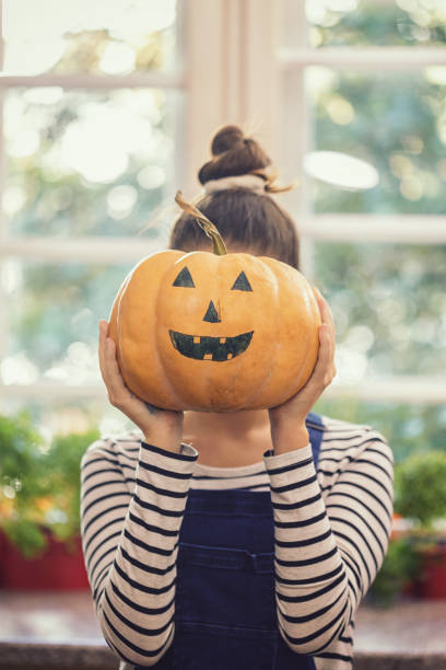 istock Young girl preparing for Halloween celebration 1172584651