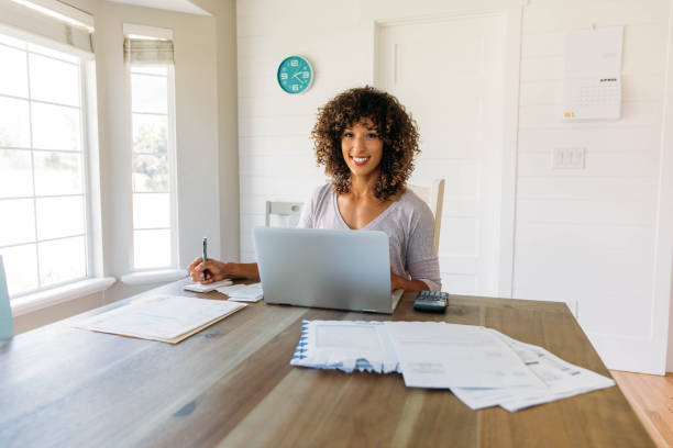 istock Woman Doing Finances at Home 1172587180