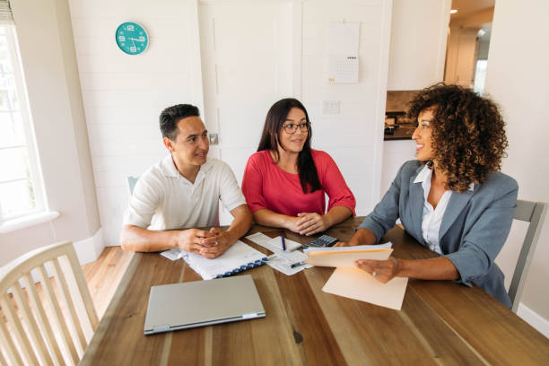 istock Married Couple Meeting with Financial Advisor 1172587262