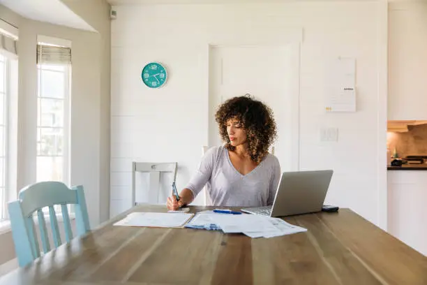 Photo of Woman Doing Finances at Home