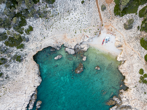 Kayaking couple on beach from above