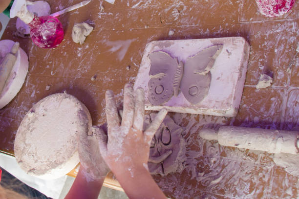 istock Hands holding Play Dough as Concept of education and therapy 1172588456