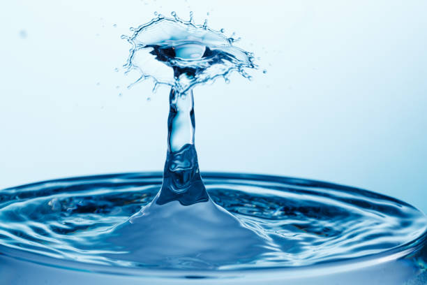 istock drop of water falling down in the water 1172590519