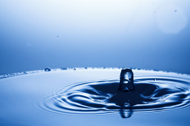 istock drop of water falling down in the water 1172591134