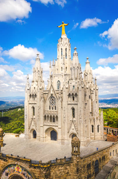 Temple of the Sacred Heart of Jesus on Tibidabo mountain in Barcelona Temple of the Sacred Heart of Jesus on Tibidabo mountain in Barcelona without people; vertical photo church like a holy light from god stock pictures, royalty-free photos & images