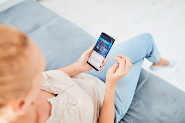 istock Woman using smart-phone inside the apartment. 1172593003