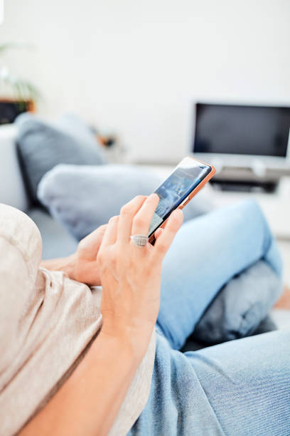 istock Woman using smart-phone inside the apartment. 1172593052