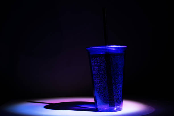 istock Cocktail glass, drinks in plastic cup with black straw 1172594381