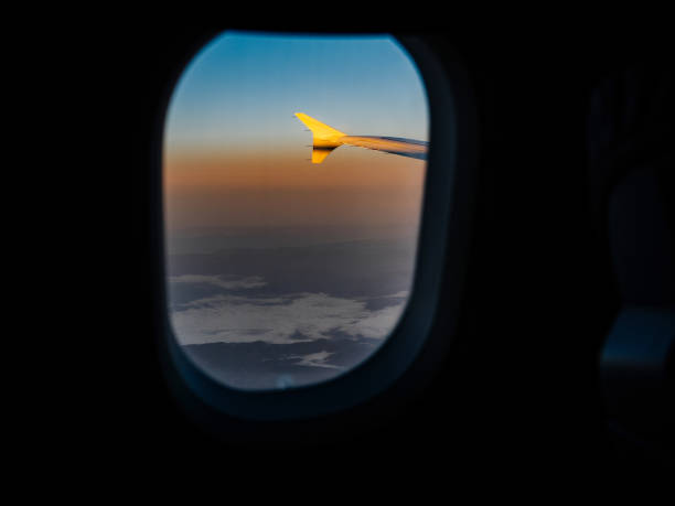 istock View through airplane window of aircraft wing 1172596185