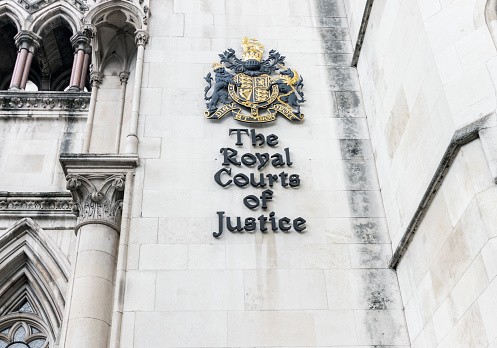 Crest on the wall of Royal Courts of Justice on the Strand in central london