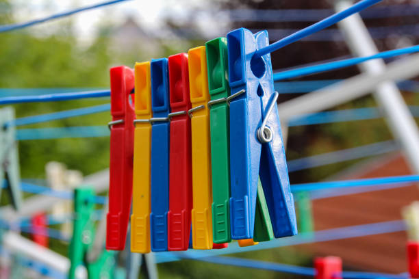 istock Close up of a colored clothespins on a clothesline 1172597220