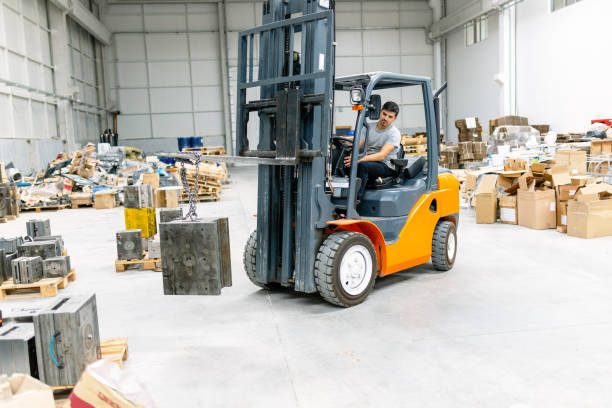 istock Man driving forklift in factory 1172597276