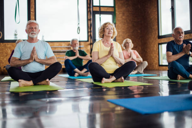 istock Group of seniors attending a meditation session 1172601200