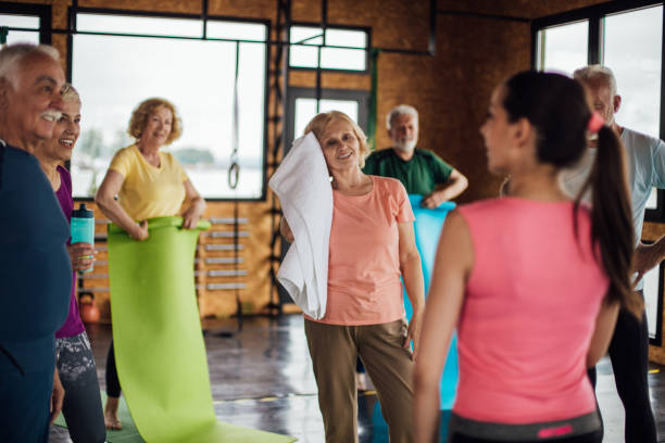 istock Happy seniors finishing a group yoga class 1172601208