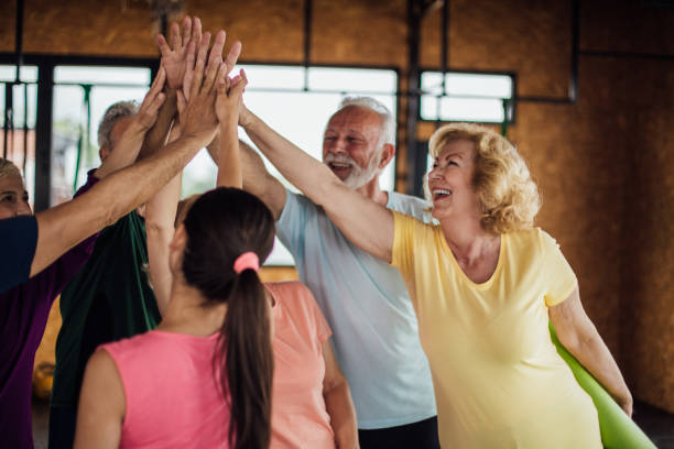 istock Happy seniors after a group yoga class 1172601209