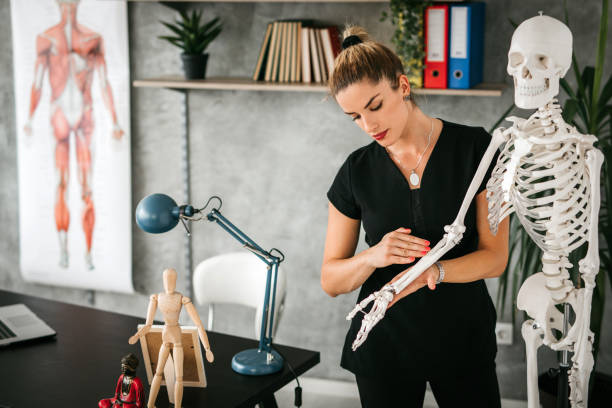 istock Massage Therapist Instructor giving lecture in classroom 1172601269